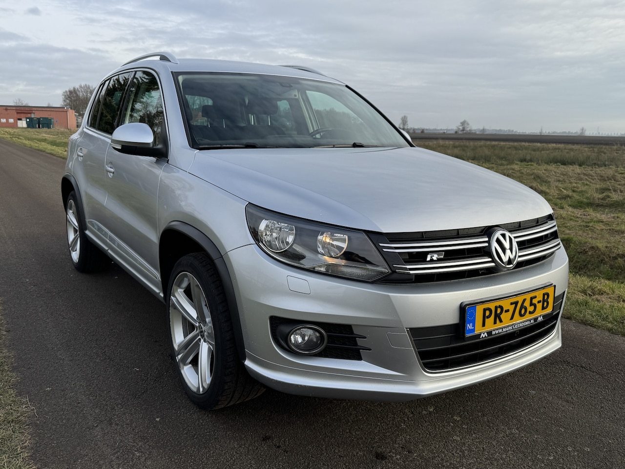 Volkswagen Tiguan - 1.4 TSI Sport&Style R-Line ECC/NAVI/PDC/CRUISE/STOELVERW. - AutoWereld.nl