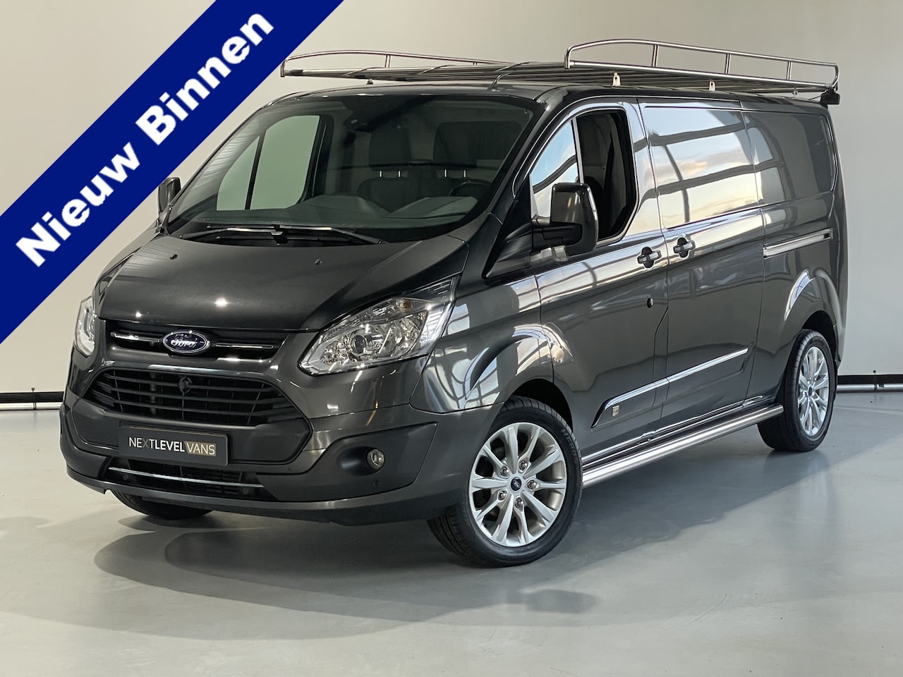 Ford Transit Custom - 290 2.0 TDCI L2H1 Anniversary Edition / Imperiaal / 2 x schuifdeur - AutoWereld.nl