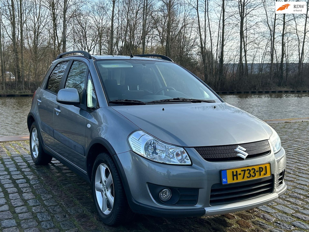 Suzuki SX4 - 1.6 Shogun Zeer mooi auto lage km airco trekhaak elektrische ramen cv op afs - AutoWereld.nl