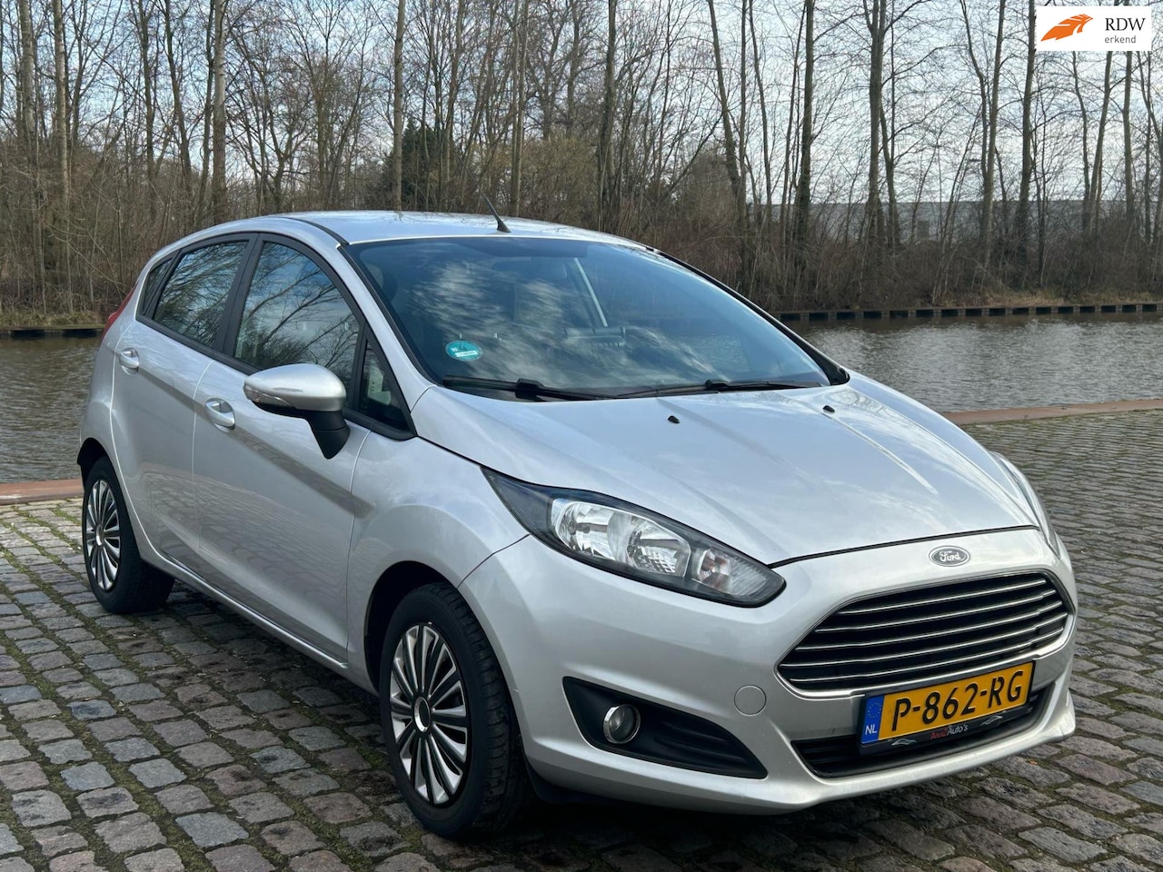 Ford Fiesta - 1.25 Titanium navigatie airco elektrische ramen cv op afs - AutoWereld.nl