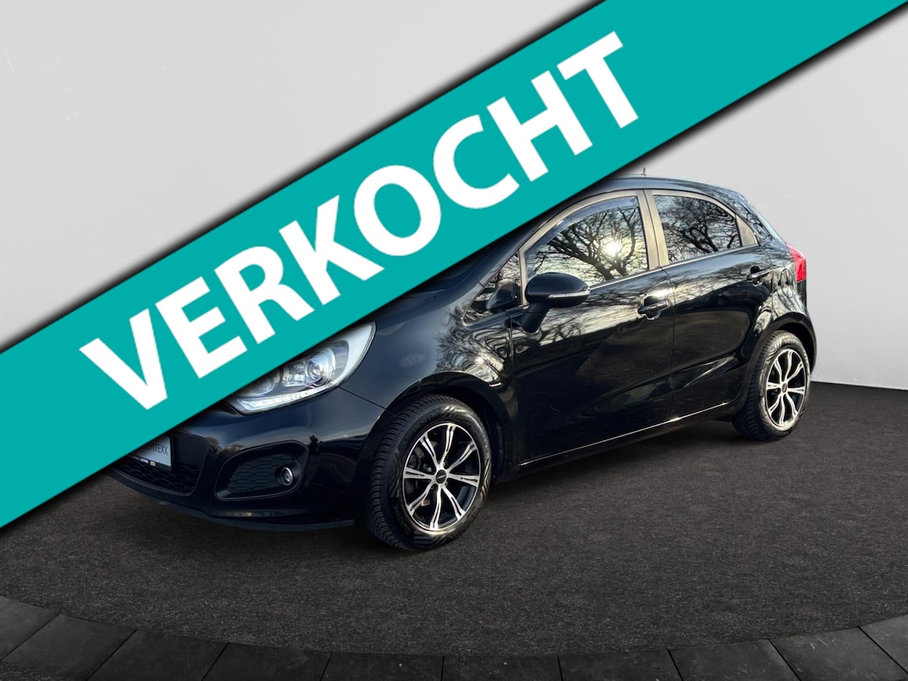 Kia Rio - 1.2 CVVT Super Pack | Cruise | Navi | Clima | Camera | PDC Achter | Leder | Trekhaak Afn. - AutoWereld.nl