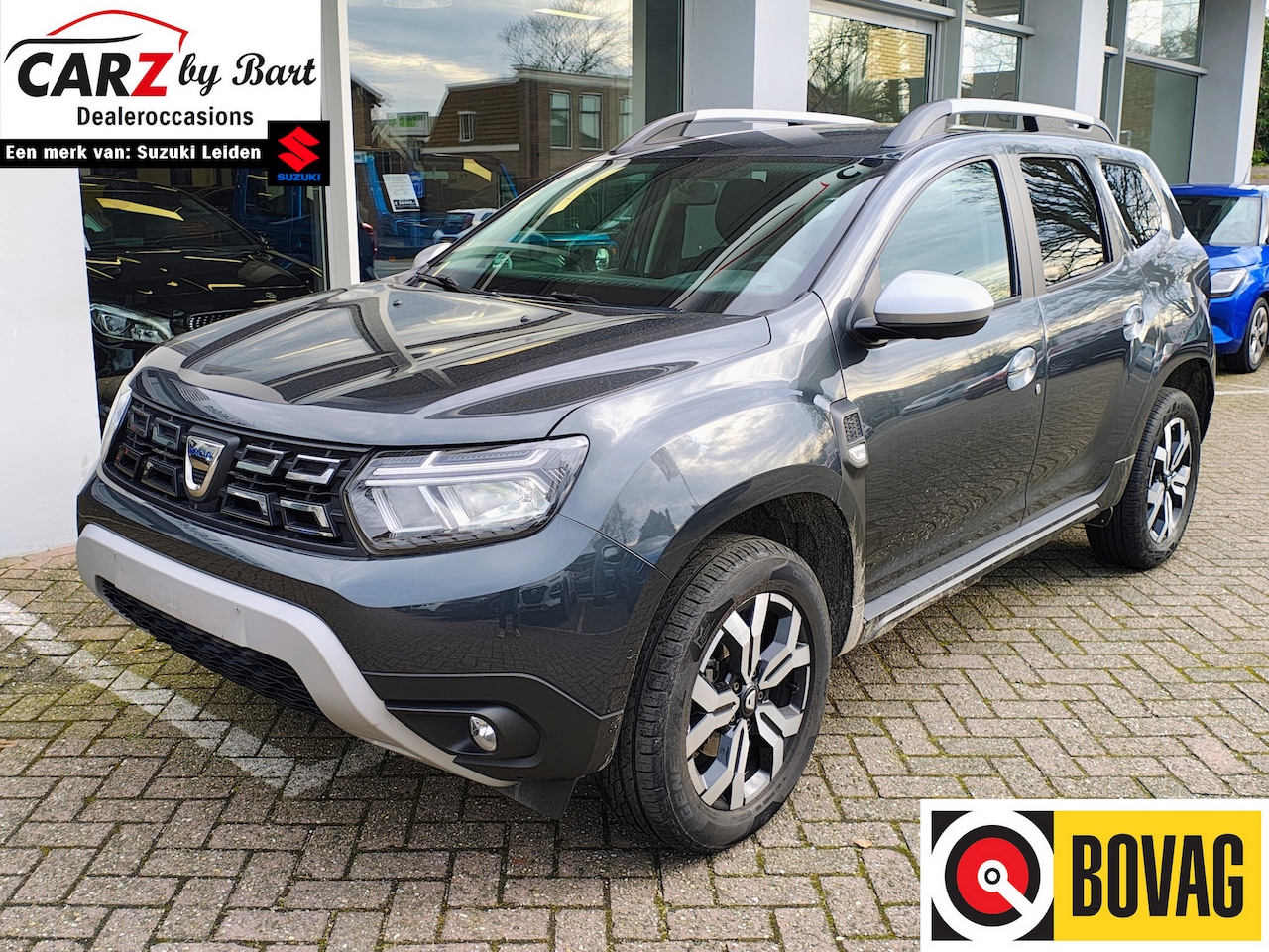 Dacia Duster - 1.3 TCe PRESTIGE AUTOMAAT Leder | Trekhaak | Stoelverwarming - AutoWereld.nl