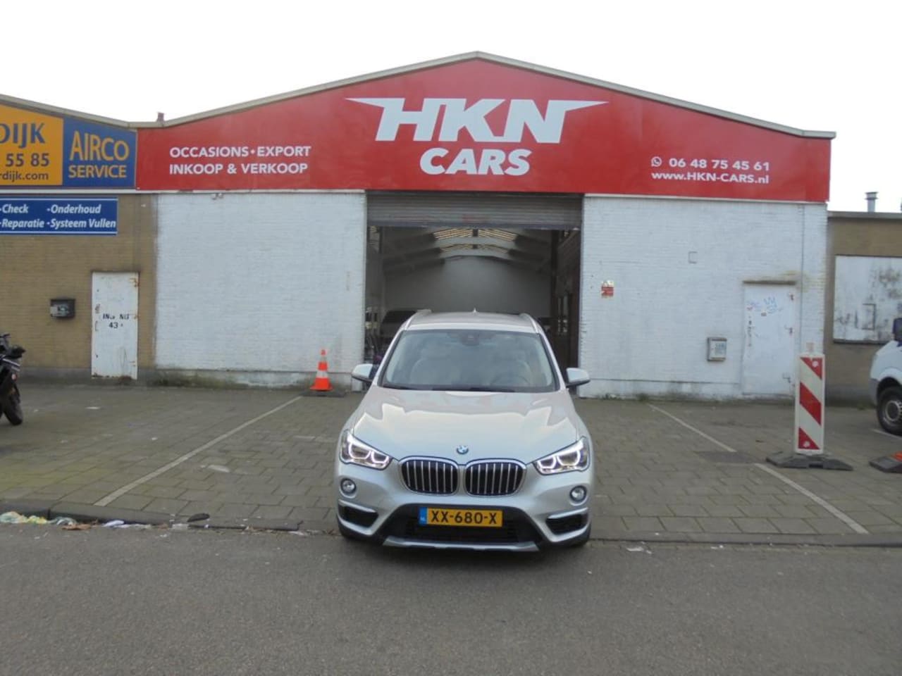 BMW X1 - SDrive18i High Executive Edition bj 2019 leerhead up grootnavi - AutoWereld.nl