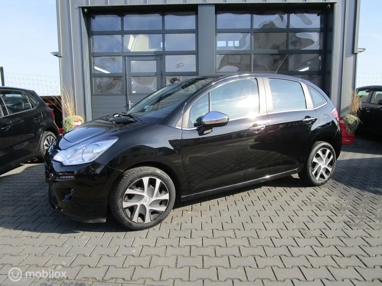 Citroën C3 - 1.2 PureTech Exclusive 105dkm Airco Cruise Navigatie - AutoWereld.nl