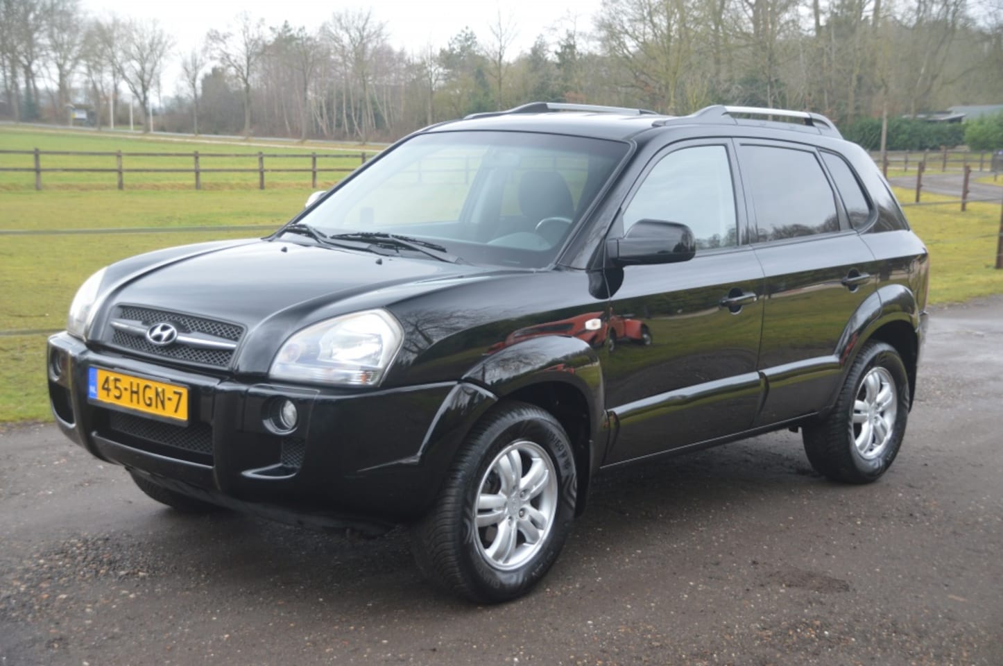 Hyundai Tucson - 2.0i Style Executive Clima Cruise PDC - AutoWereld.nl