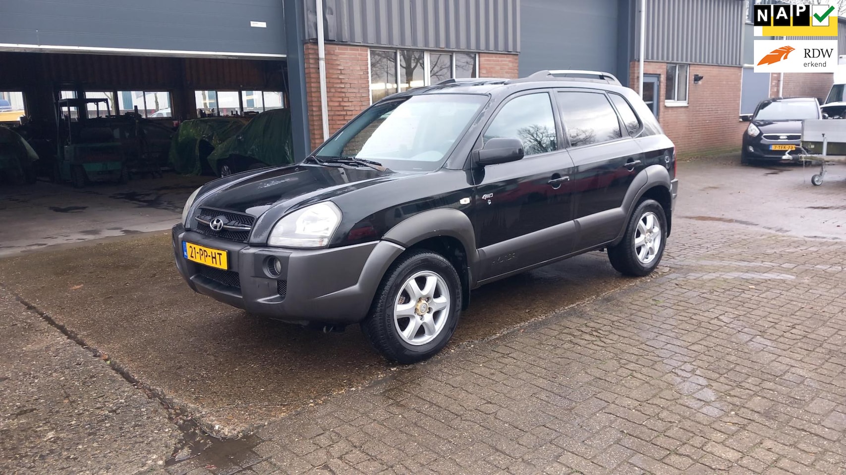 Hyundai Tucson - 2.0i 4WD Style airco - AutoWereld.nl