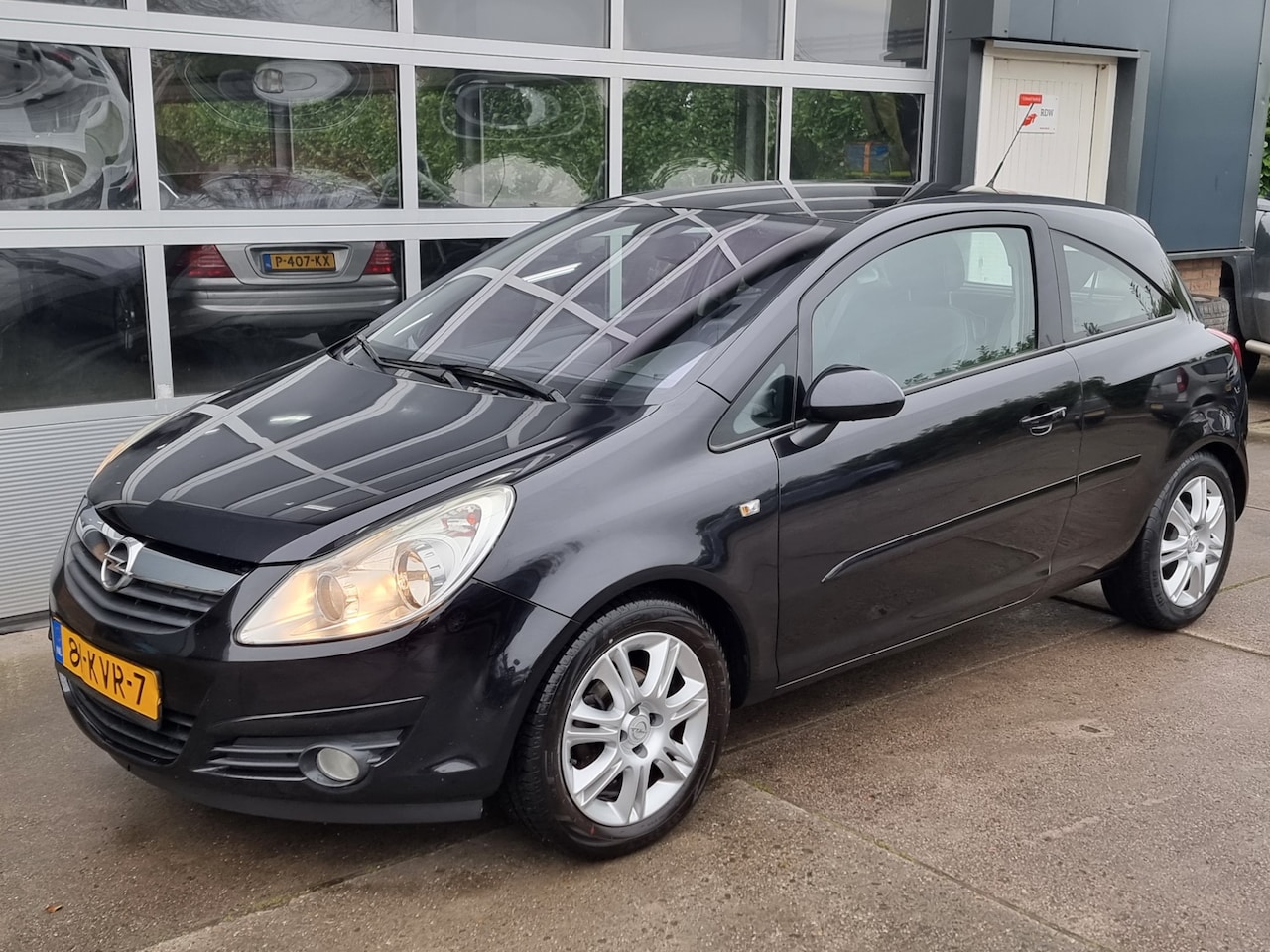 Opel Corsa - 1.4-16V Cosmo airco navi - AutoWereld.nl