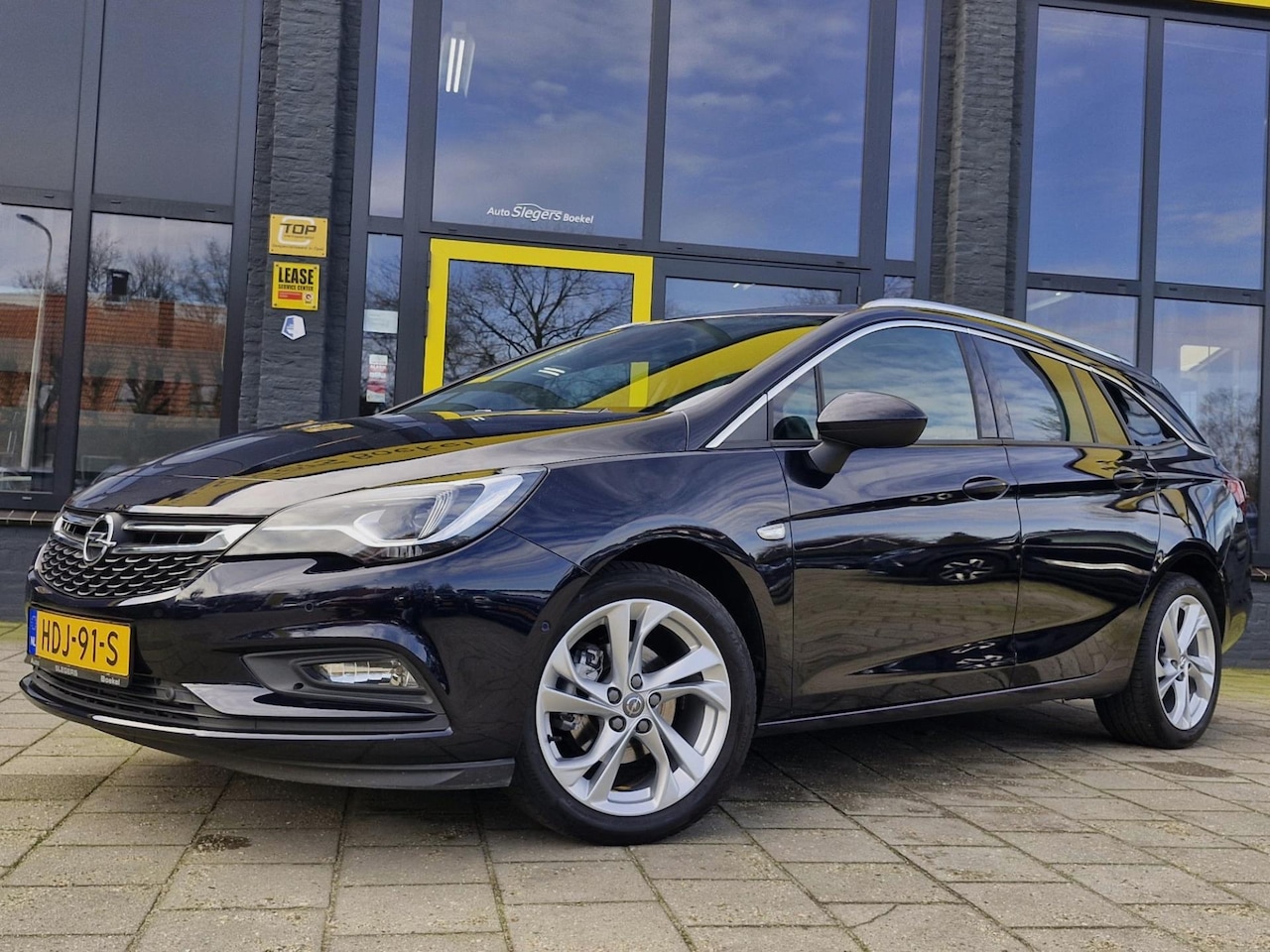 Opel Astra Sports Tourer - 1.4 Turbo S/S | Stoelv Voor + Achter | Stuurv | Camera + Sensoren | Navi | Tel | Apple Car - AutoWereld.nl