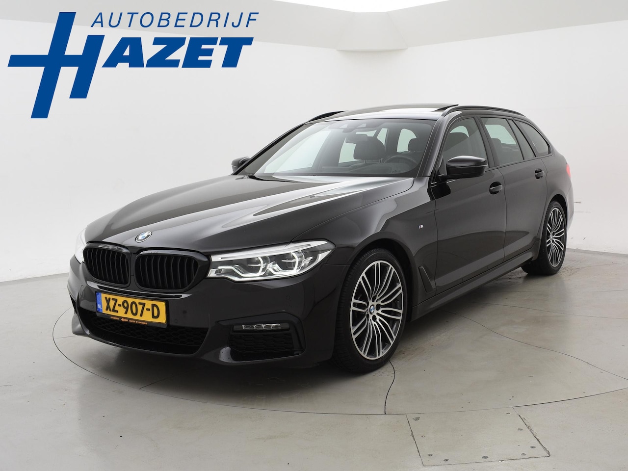 BMW 5-serie Touring - 520i 184 PK M-SPORT H.E. AUT. *ALMANDINBRAUN* + PANORAMA | NAPPA LEDER | HEAD-UP | 19 INCH - AutoWereld.nl