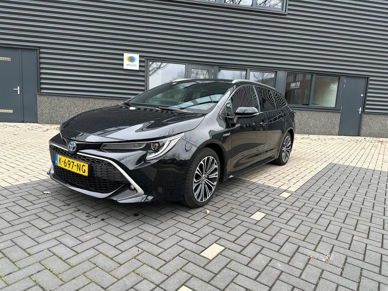 Toyota Corolla Touring Sports - 1.8 Hybrid Executive / BTW / Sportief / Leer - AutoWereld.nl