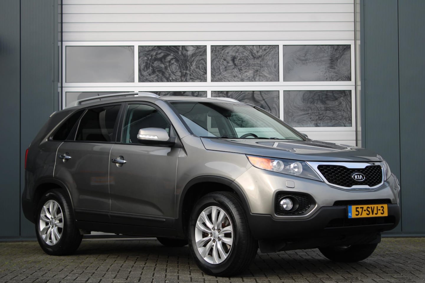 Kia Sorento - 2.4 X-clusive Clima/Cruise/Nav/Xenon/Bluetooth/Camera/Stoelverwarming/Leder/18"LM/RadioAUX - AutoWereld.nl