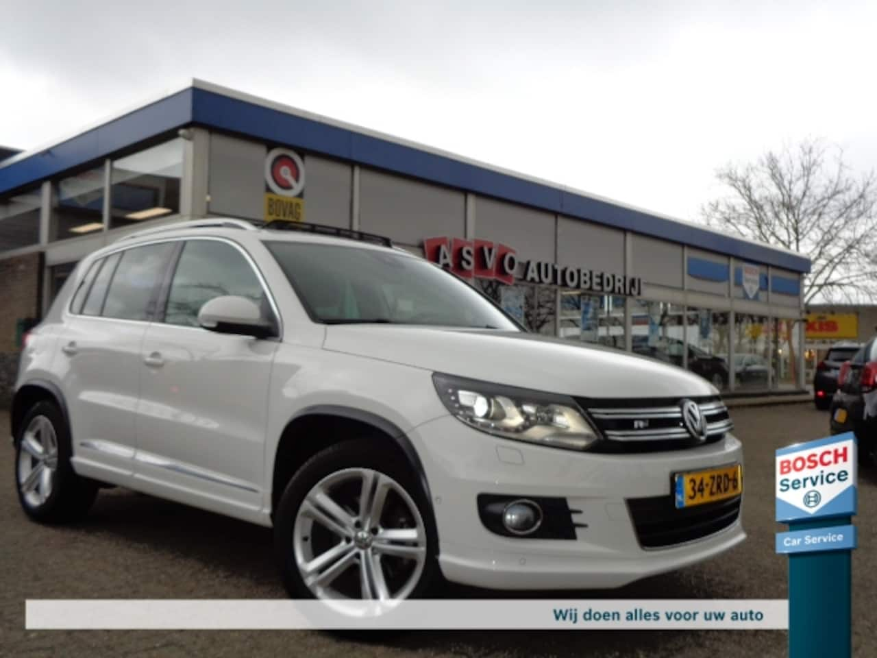 Volkswagen Tiguan - 1.4 TSI 160pk Sport&Style R-line Trekh.Pano - AutoWereld.nl