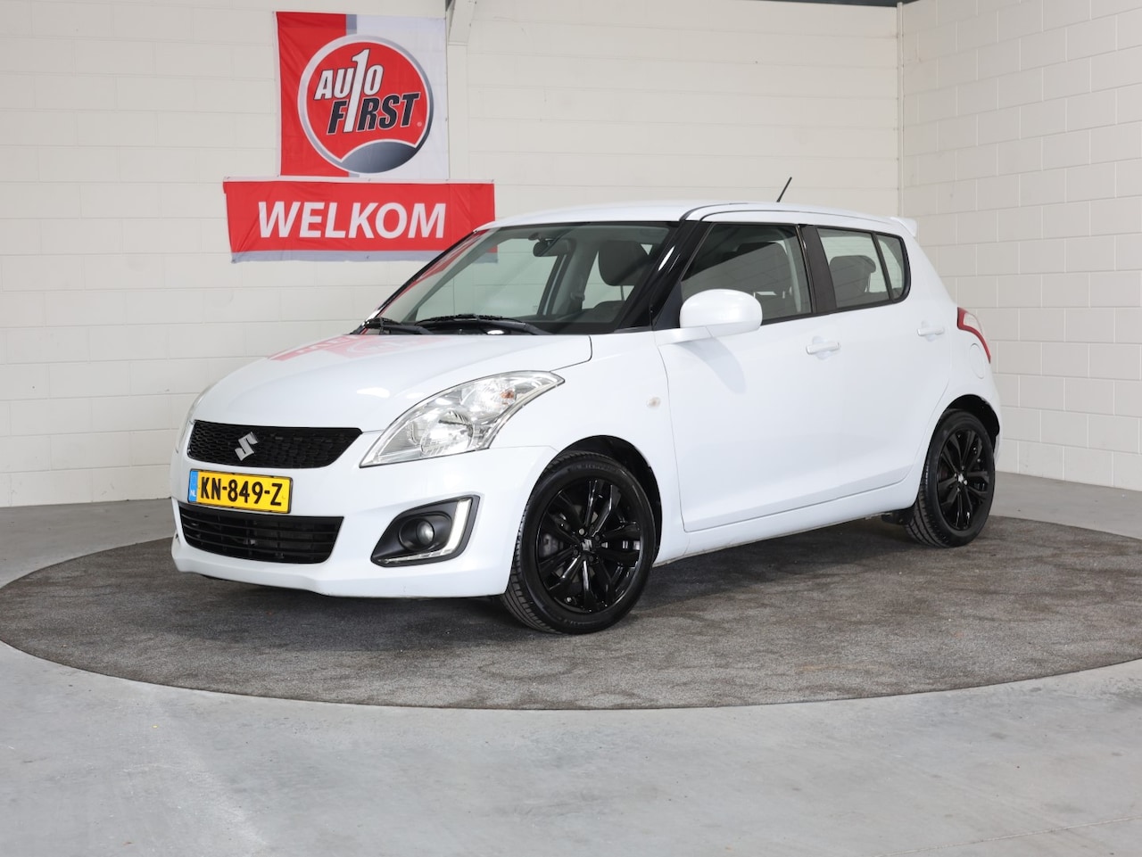 Suzuki Swift - 1.2 Bandit 5Drs. NL, 1e Eigenaresse, Dealer oh. Airco, Cruise control, enz. .. Stoelverwar - AutoWereld.nl