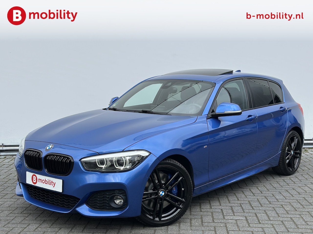 BMW 1-serie - 120i High Executive M-Sport Schuif/Kanteldak | Apple CarPlay | Achteruitrijcamera | Harman - AutoWereld.nl