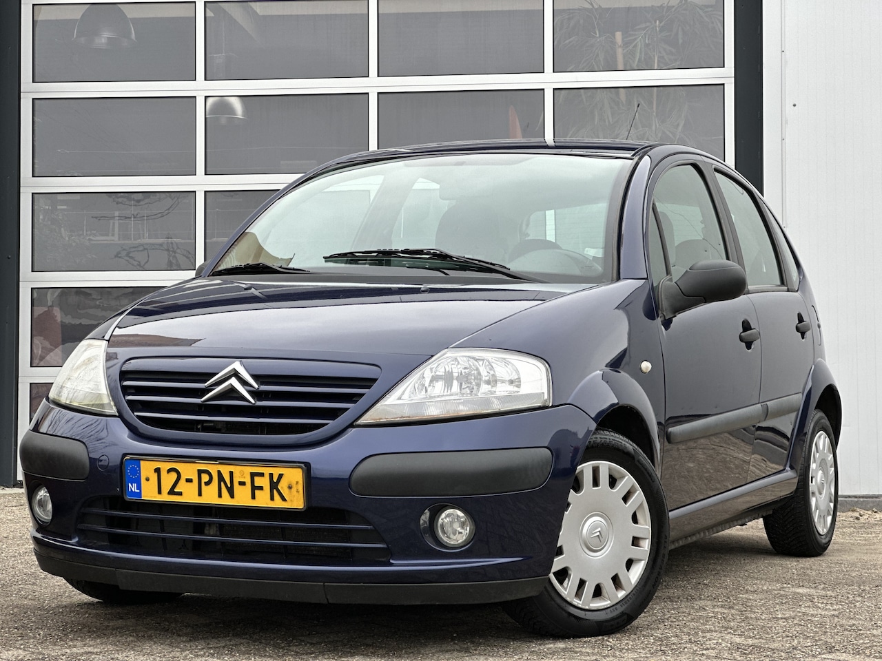 Citroën C3 - 1.4i Différence 75pk | 5-deurs | Airco | Armsteun | Cruise Control | Elek. ramen | Radio-C - AutoWereld.nl