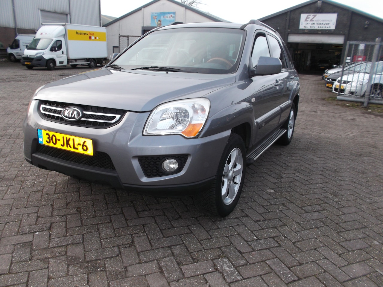 Kia Sportage - 2.0 CVVT Fifteen 4WD (4x4) airco half leer - AutoWereld.nl