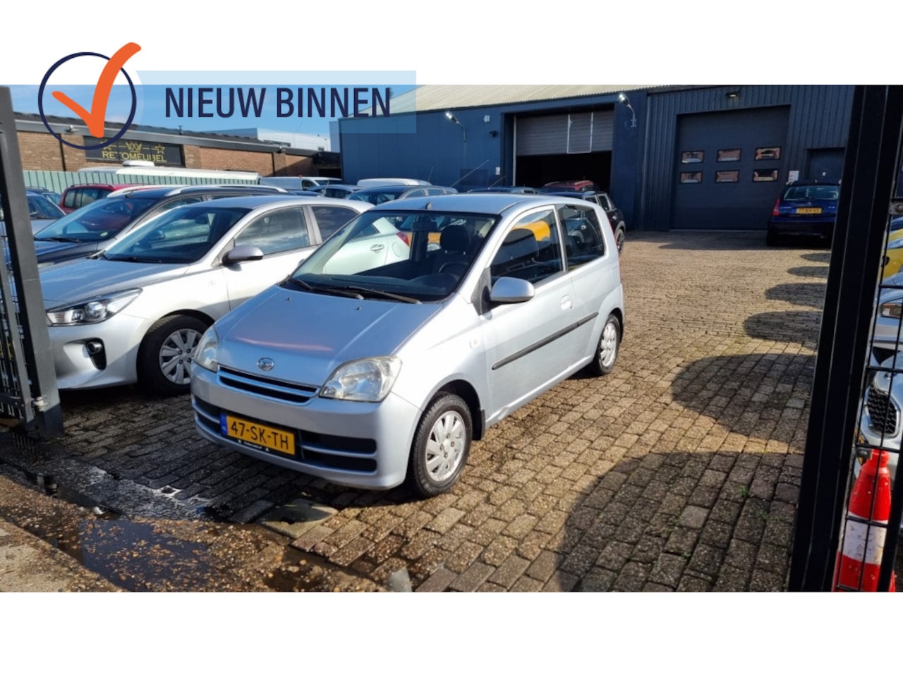 Daihatsu Cuore - 1.0-12V Sporty 1.0-12V Sporty - AutoWereld.nl