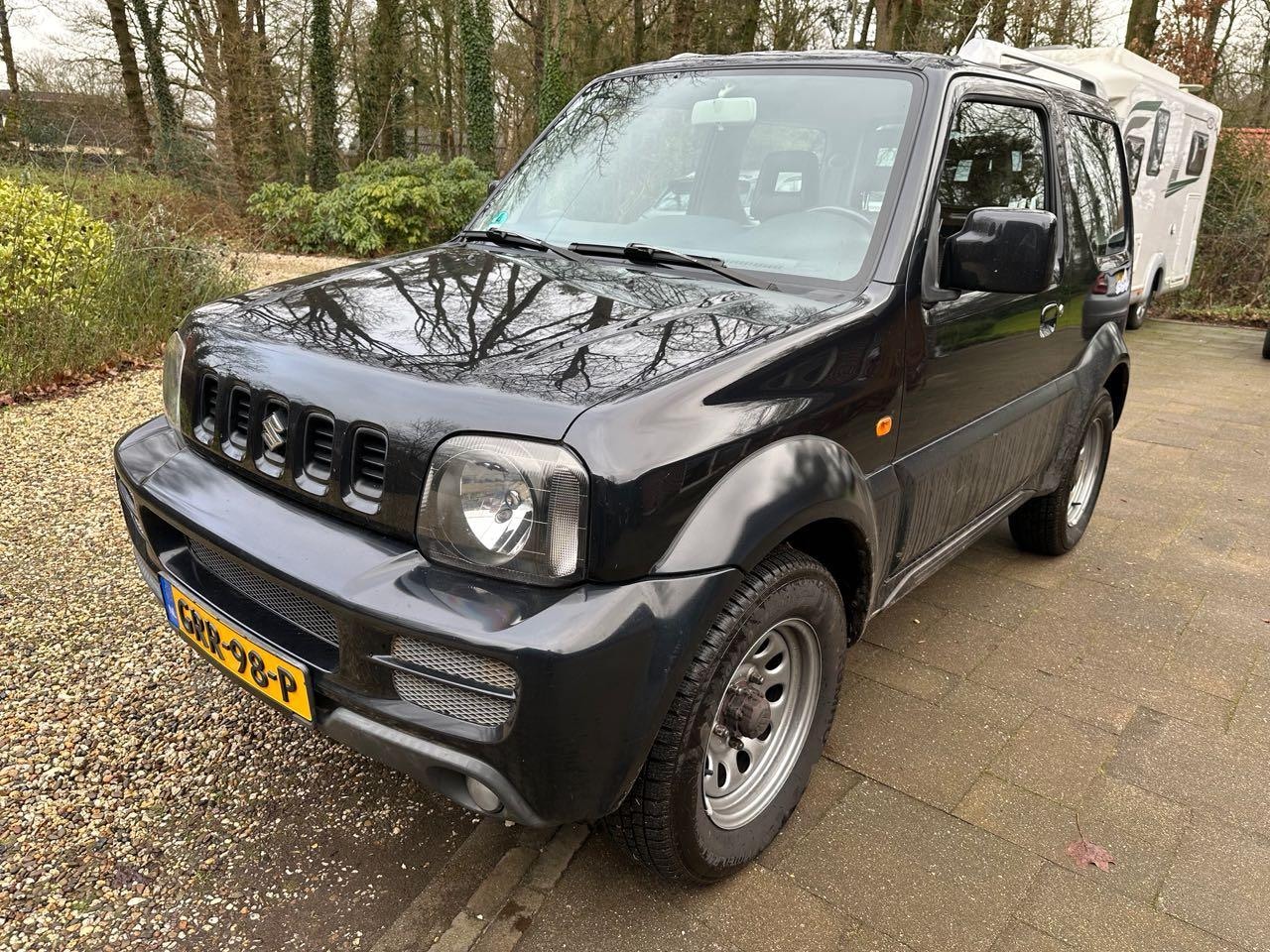 Suzuki Jimny - 1.3 Special Edition Airco Halfleer Stoelverwarming 85DKM - AutoWereld.nl