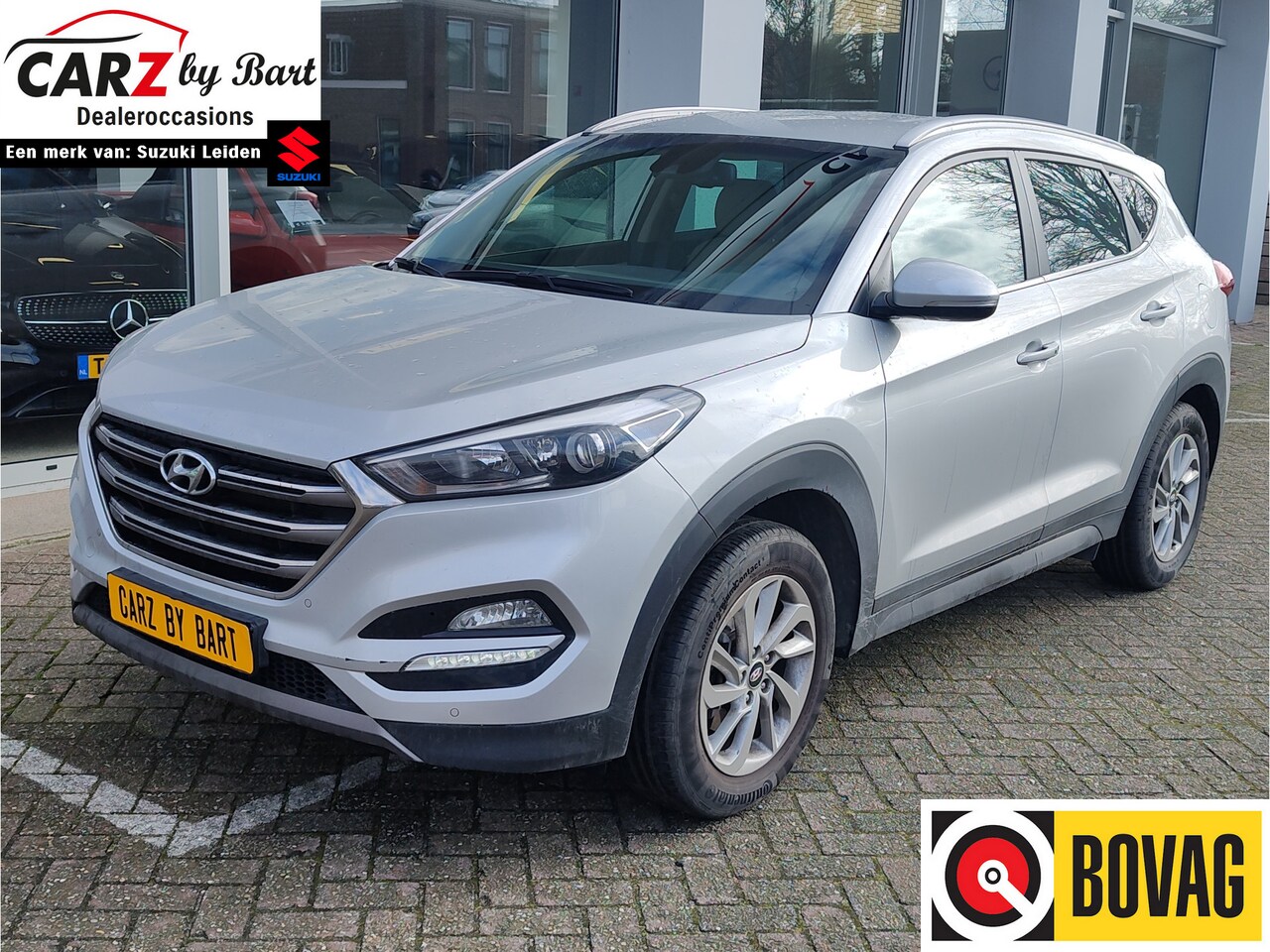 Hyundai Tucson - 1.6 GDi PREMIUM Trekhaak | Beige leder | Keyless | Navi - AutoWereld.nl