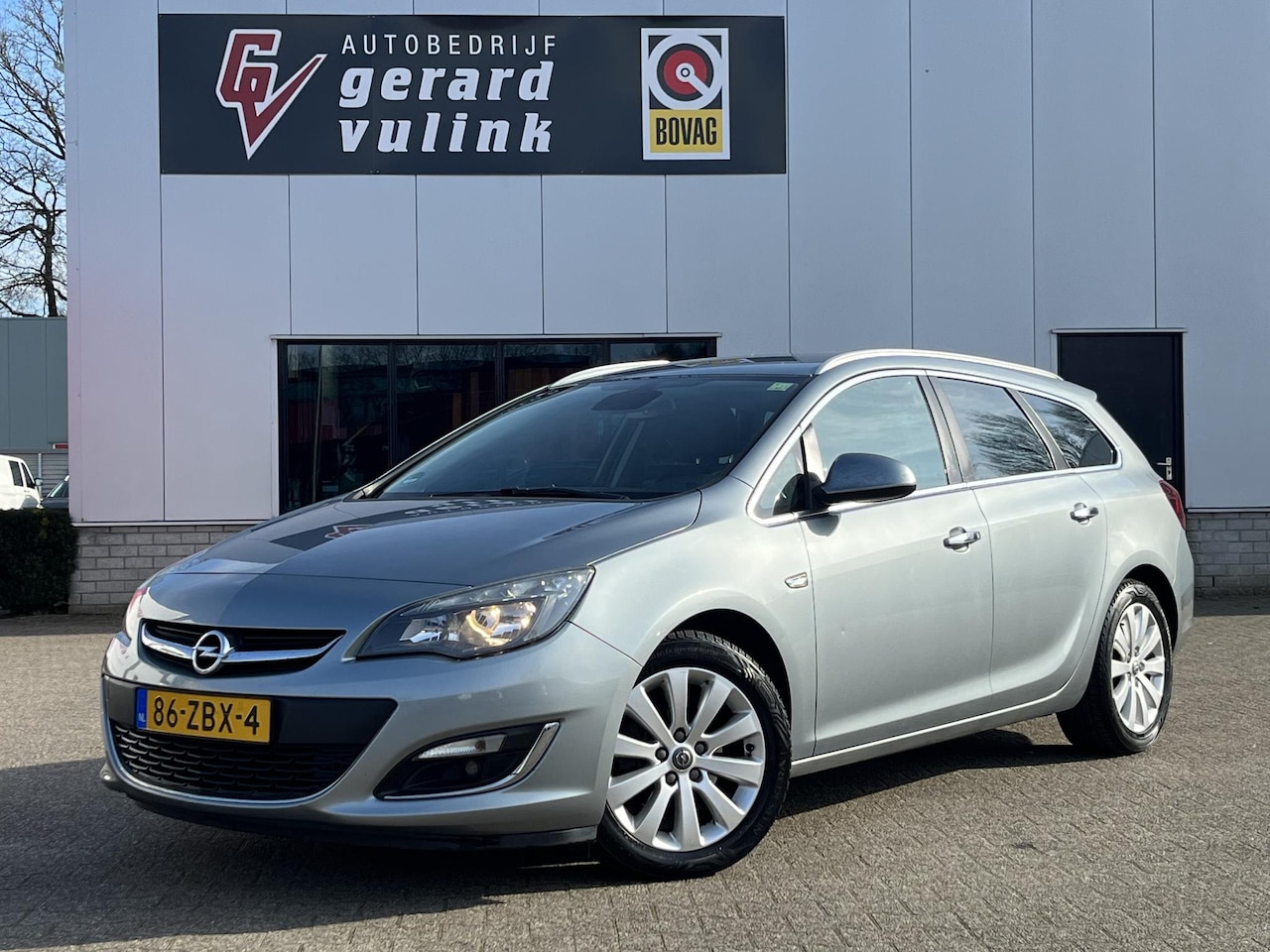 Opel Astra Sports Tourer - 1.7 CDTi Cosmo CLIMA CRUISE NAV TREKHAAK - AutoWereld.nl