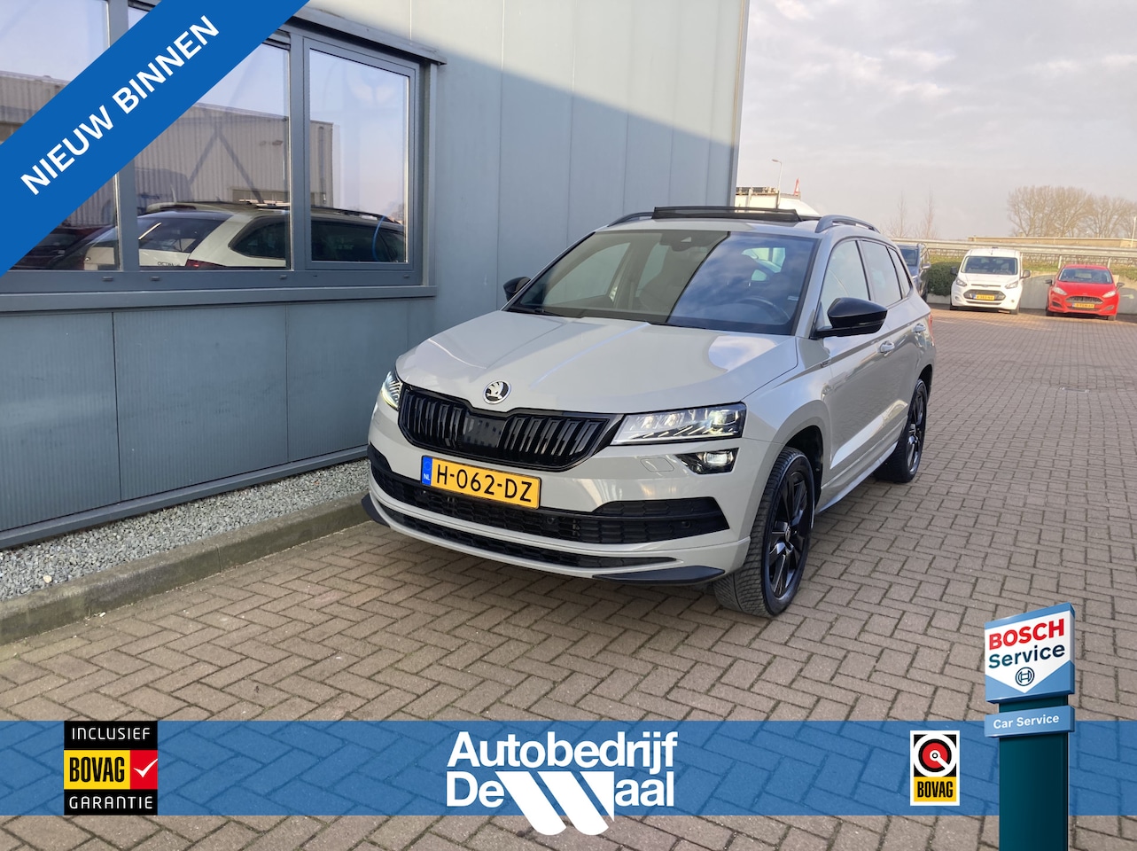 Skoda Karoq - 1.5 TSI 150PK DSG Sportline Business SCHUIFDAK/ADAPT.CRUISE/TREHK.WEGKLAPBAAR/WINTERPACK - AutoWereld.nl