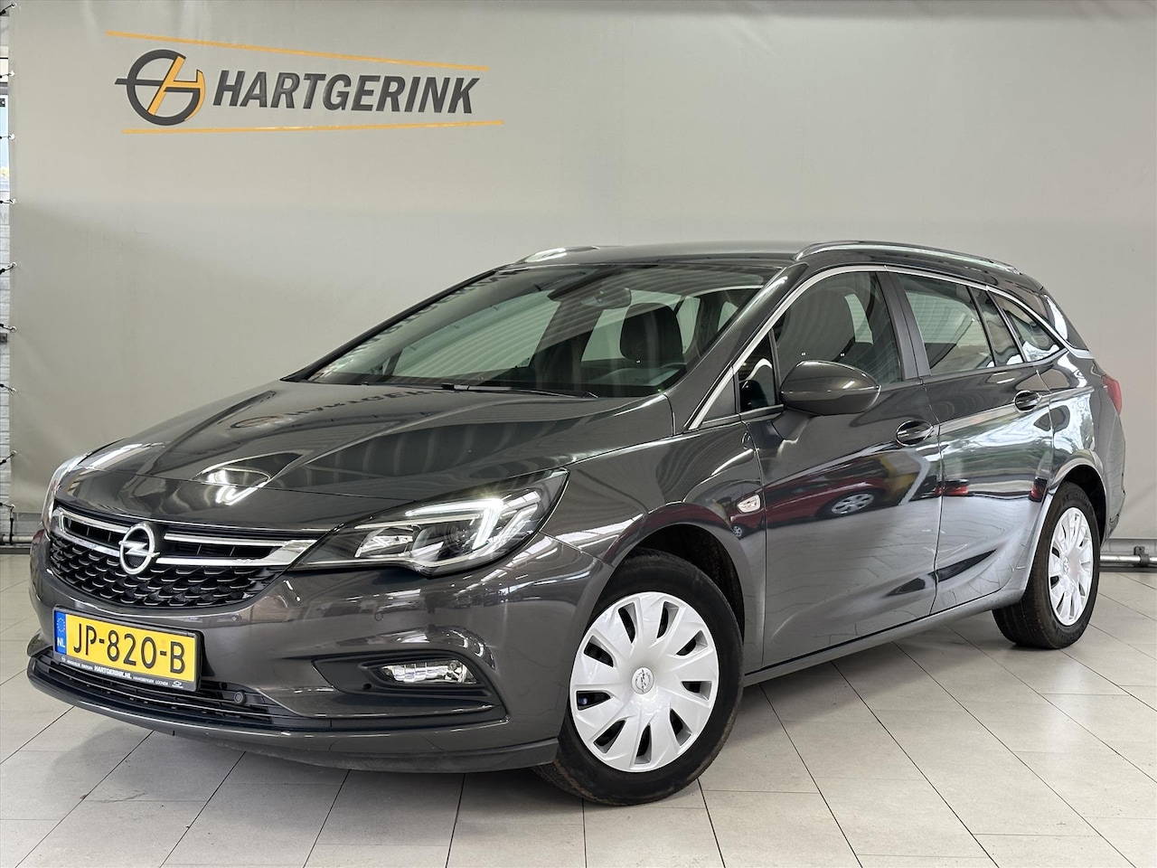 Opel Astra Sports Tourer - 1.4 Turbo 150pk Business+* Navi / Cruise / Airco / PDC / Trekhaak - AutoWereld.nl