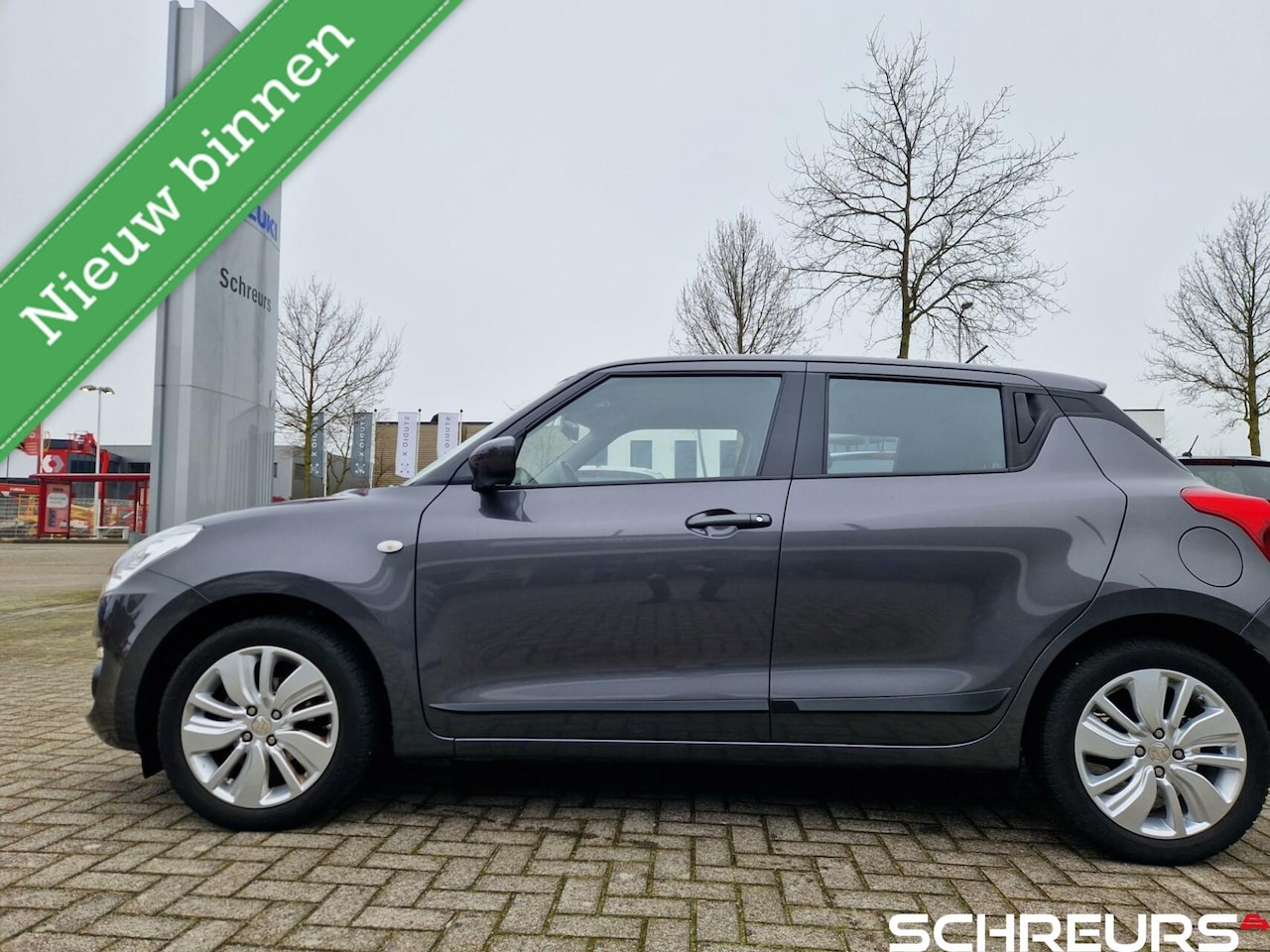 Suzuki Swift - 1.2 Comfort|Lichtmetaal|Cruise Controle|Stoelverwarming|Trekhaak|Rijklaar prijs - AutoWereld.nl