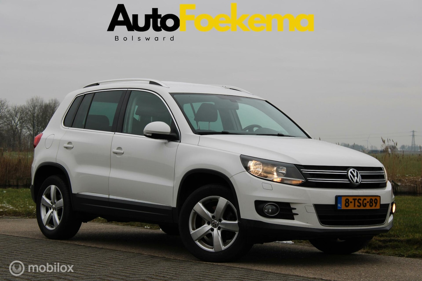 Volkswagen Tiguan - 1.4 TSI Sport&Style UITKLAPBARE TREKHAAK NAVI AIRCO - AutoWereld.nl