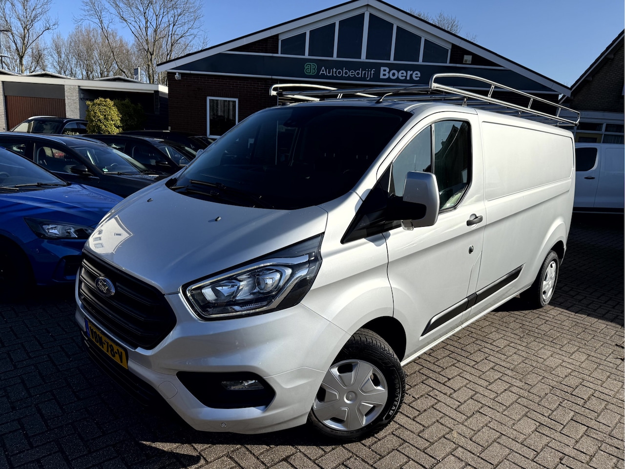 Ford Transit Custom - 2.0 TDCI 130pk L2 H1 Lang Trend Trekhaak, Imperiaal, Camera - AutoWereld.nl