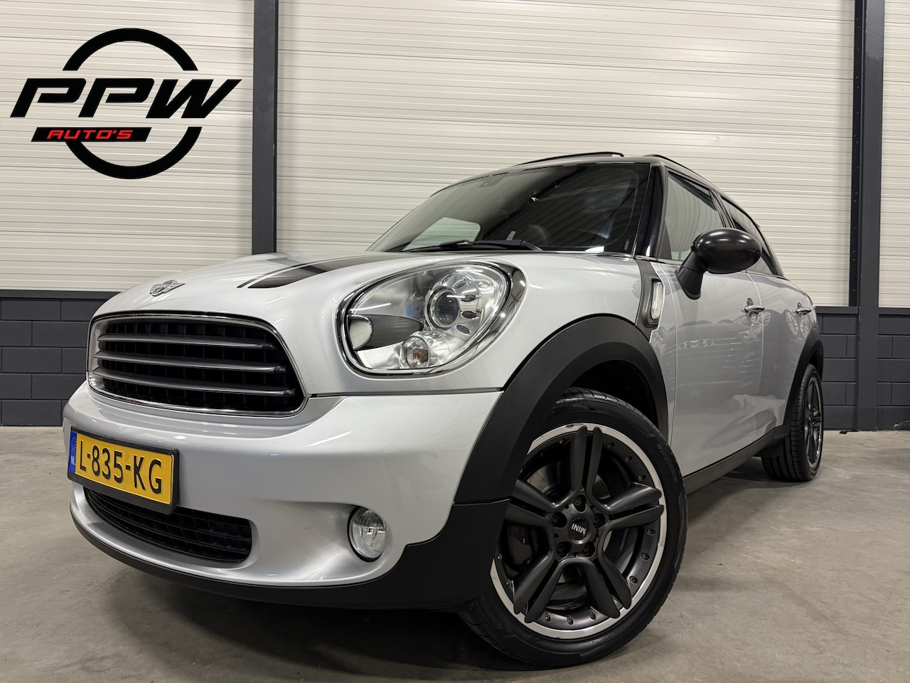 MINI Countryman - 1.6 Cooper Chili Aut. 91.632km!/PANO/XENON/18"/H.LEER/NAVI/BLUETOOTH/SFEER/PARKEERSENSOREN - AutoWereld.nl