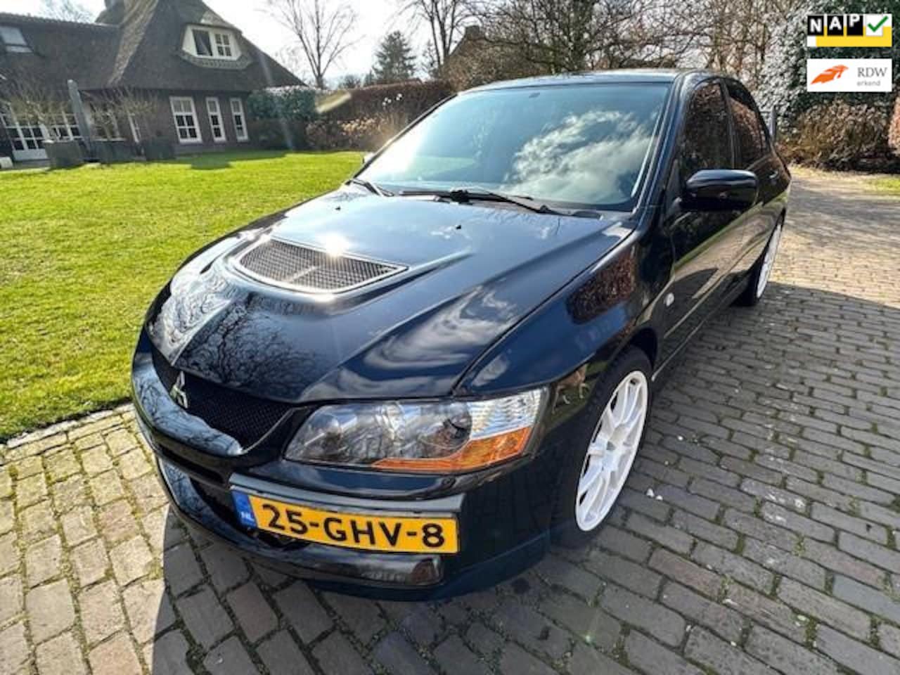 Mitsubishi Lancer Evolution - 2.0 Evo IX 2007 zwart Evolution 9 - AutoWereld.nl