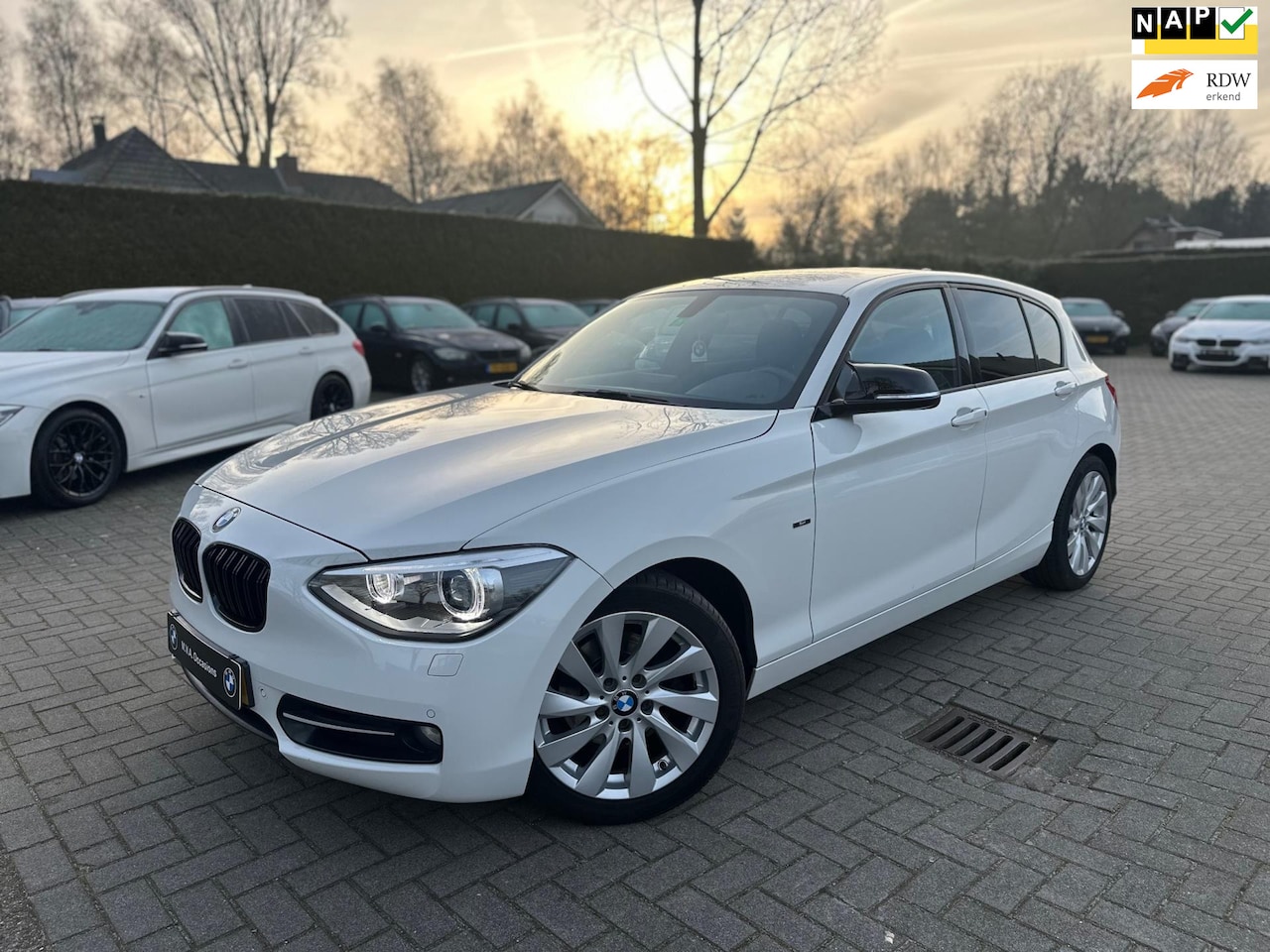 BMW 1-serie - 118i Business+ Sport|Nwe Ketting + Klepseals|Groot Navi|Climate control|Cruise control|Sto - AutoWereld.nl