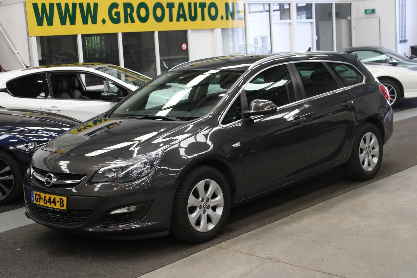 Opel Astra Sports Tourer - 1.4 Blitz NAP, Airco, Cruise control, Navi, Stuurbekrachtiging - AutoWereld.nl