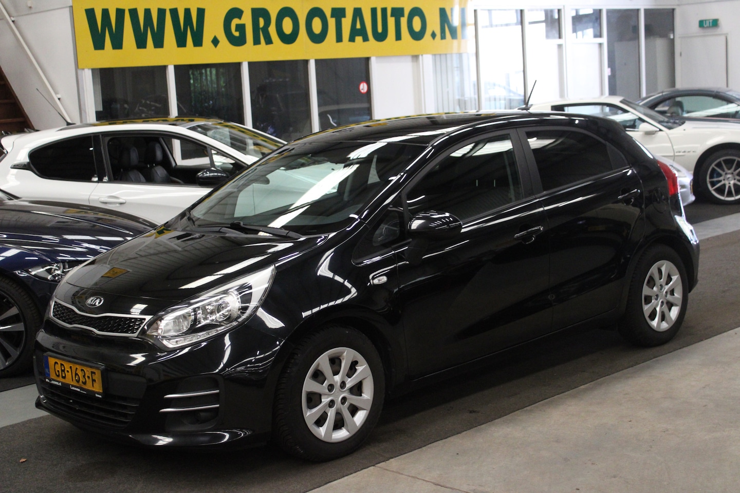 Kia Rio - 1.2 CVVT DynamicLine NAP, Airco, Navi, Cruise control - AutoWereld.nl