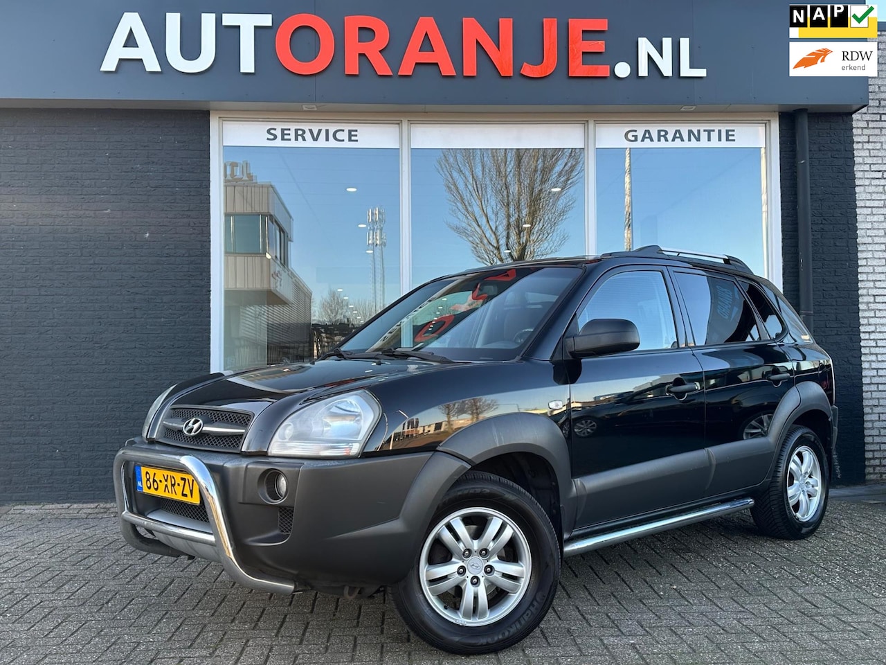 Hyundai Tucson - 2.0i Dynamic Cross-Airco-Cruise-Navi-APK-NAP!! - AutoWereld.nl