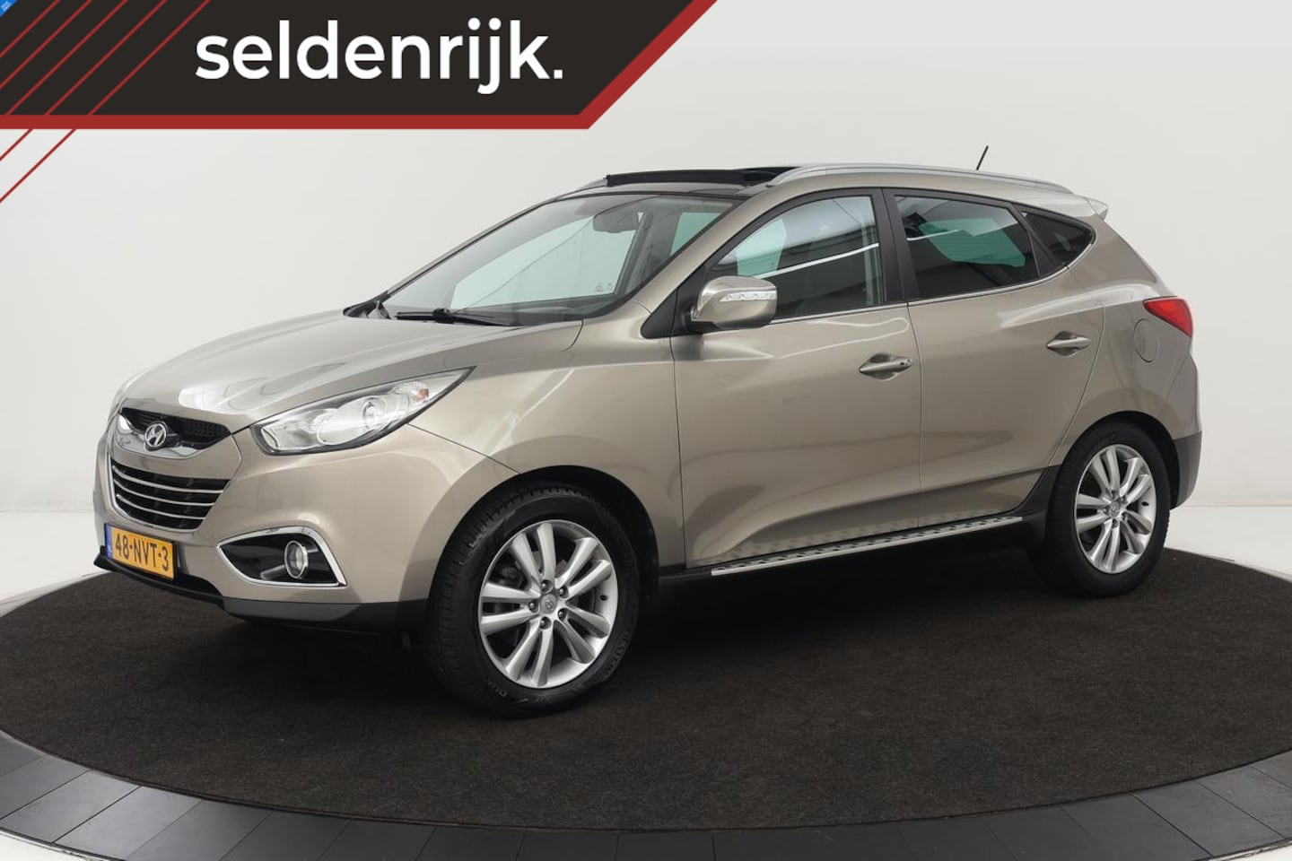 Hyundai ix35 - 2.0i 4WD i-Catcher | 2e eigenaar | Panoramadak | Leder | Trekhaak | Camera | Navigatie | C - AutoWereld.nl