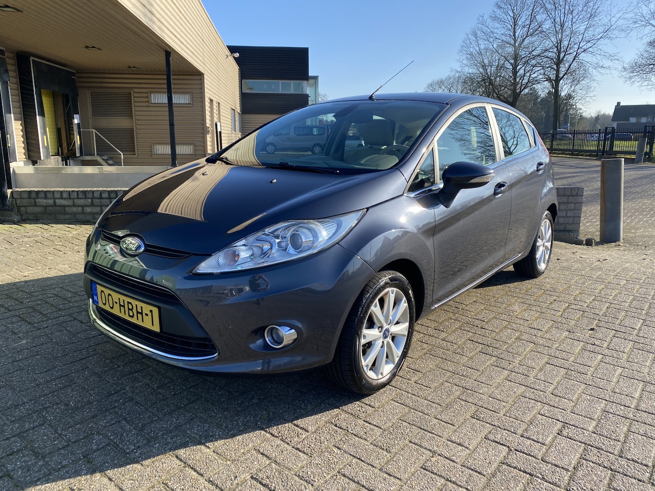 Ford Fiesta - 1.25 Ghia 5 Deurs [ ecc,audio,cruise,lmv,pdc ] - AutoWereld.nl