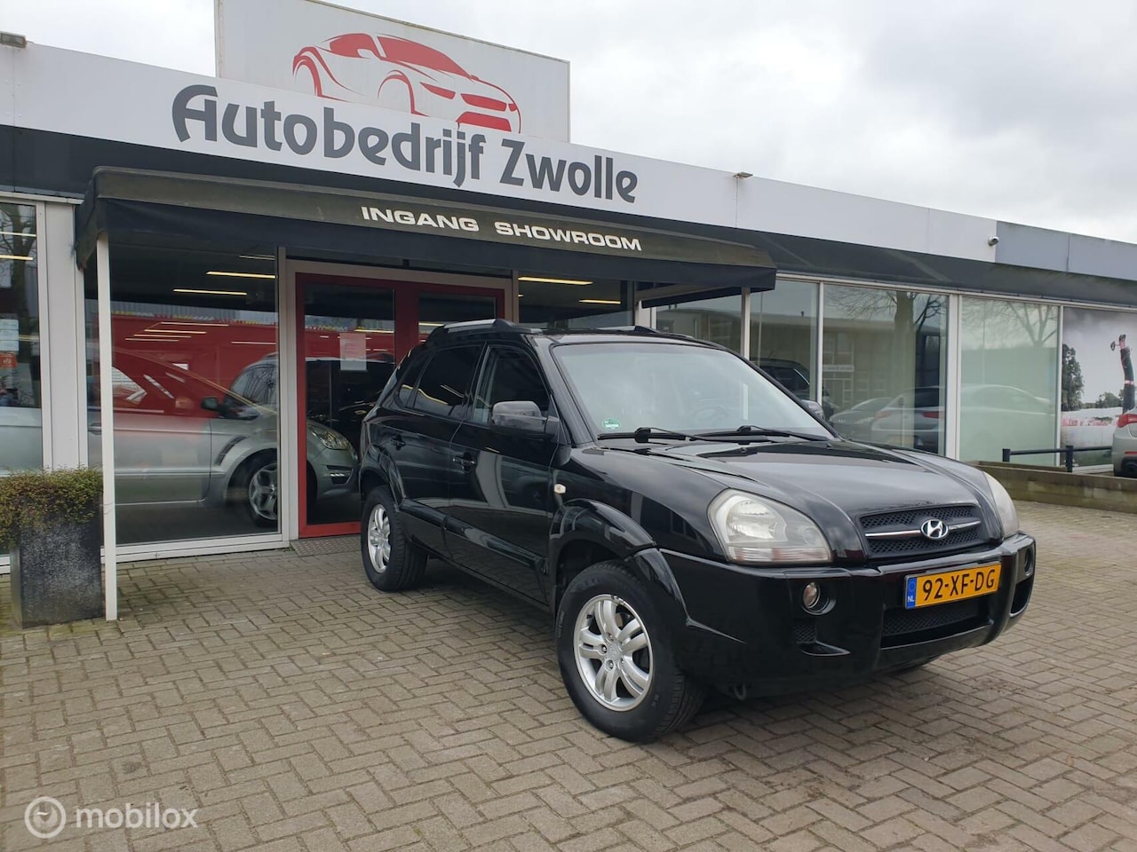 Hyundai Tucson - 2.0i Dynamic *AIRCO*CRUISE-CONTROLL*APK*NAP* - AutoWereld.nl