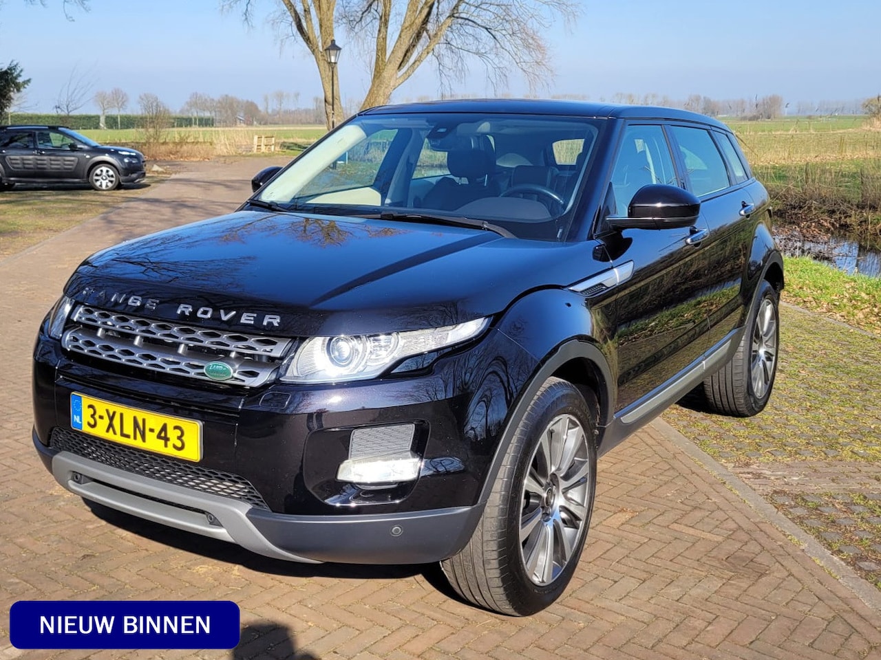 Land Rover Range Rover Evoque - 2.0 Si 4WD Prestige / Stoelverwarming / Panoramadak / Xenon - AutoWereld.nl