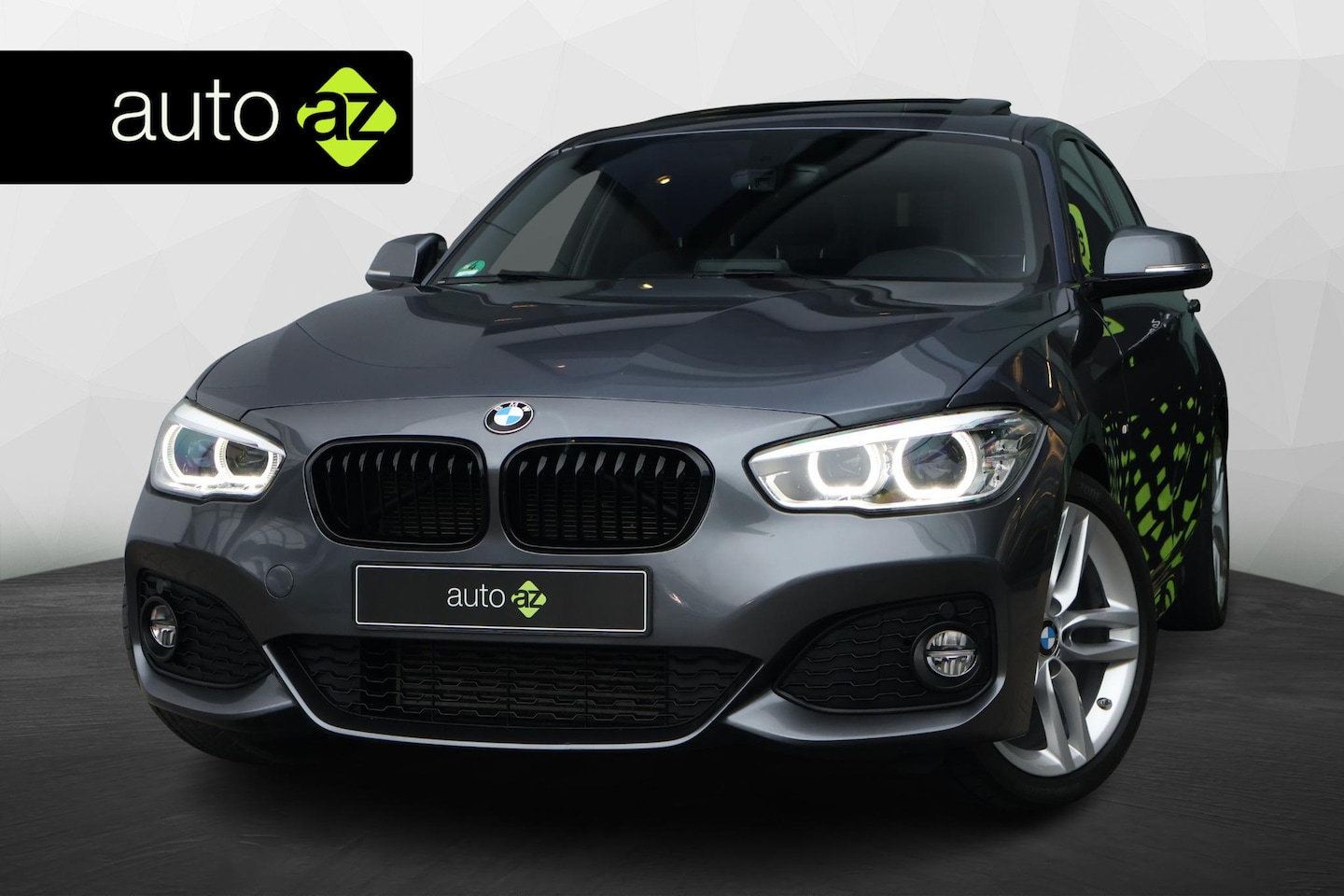 BMW 1-serie - 118i Executive M Sport / Schuifdak / H&K - AutoWereld.nl