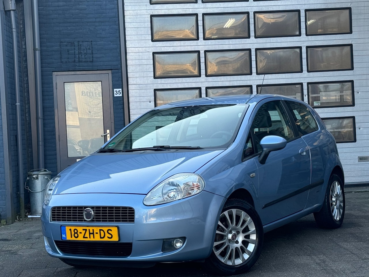 Fiat Grande Punto - 1.4 Dynamic | Airco | Navi | Cruise | N.A.P - AutoWereld.nl