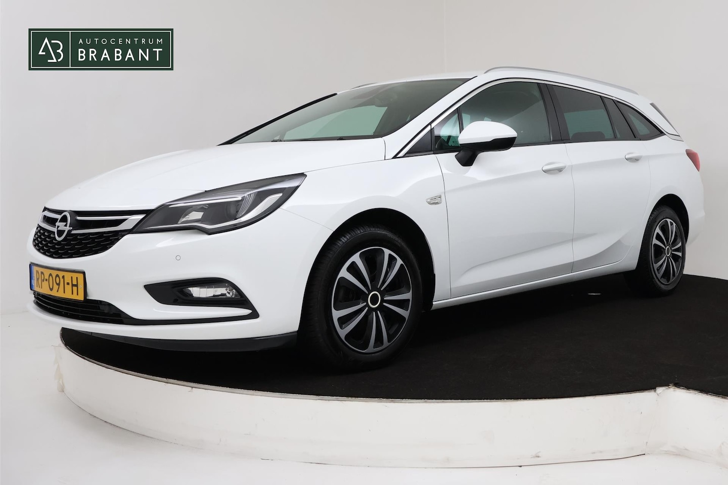 Opel Astra Sports Tourer - 1.4 Business+ (PARKEERSENSOREN, TREKHAAK, CRUISE CONTROL, NAVI, BLUETOOTH, NL-AUTO, GOED O - AutoWereld.nl