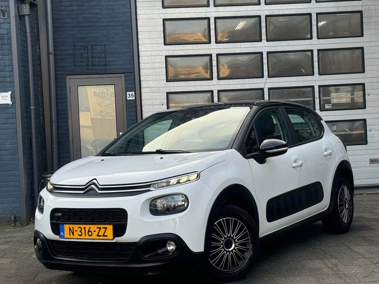 Citroën C3 - 1.2 PureTech Feel | Clima | Navi | Cruise | PDC - AutoWereld.nl