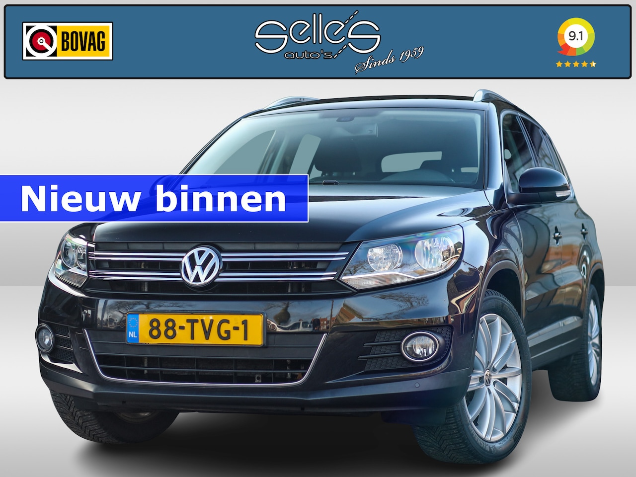 Volkswagen Tiguan - 1.4 TSI Sport&Style parkeersensoren | Navigatie | Lichtmetalen velgen - AutoWereld.nl