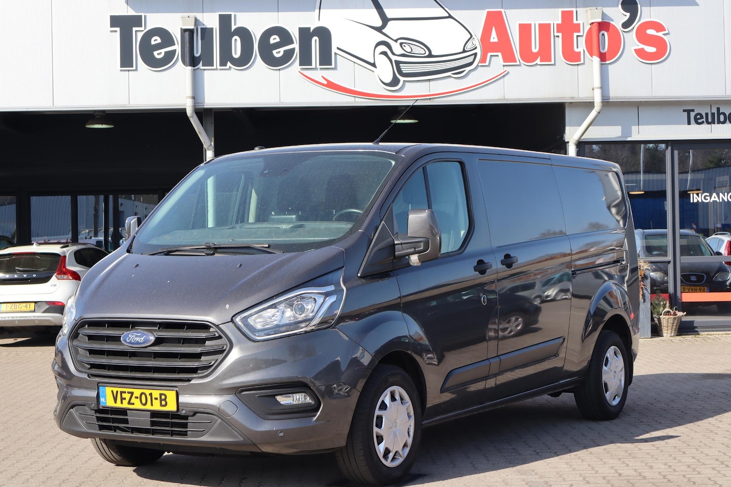 Ford Transit Custom - 320 2.0 TDCI L2H2 Limited Navigatie, Cruise control, Airco, Bijrijdersbank, Trekhaak, Link - AutoWereld.nl