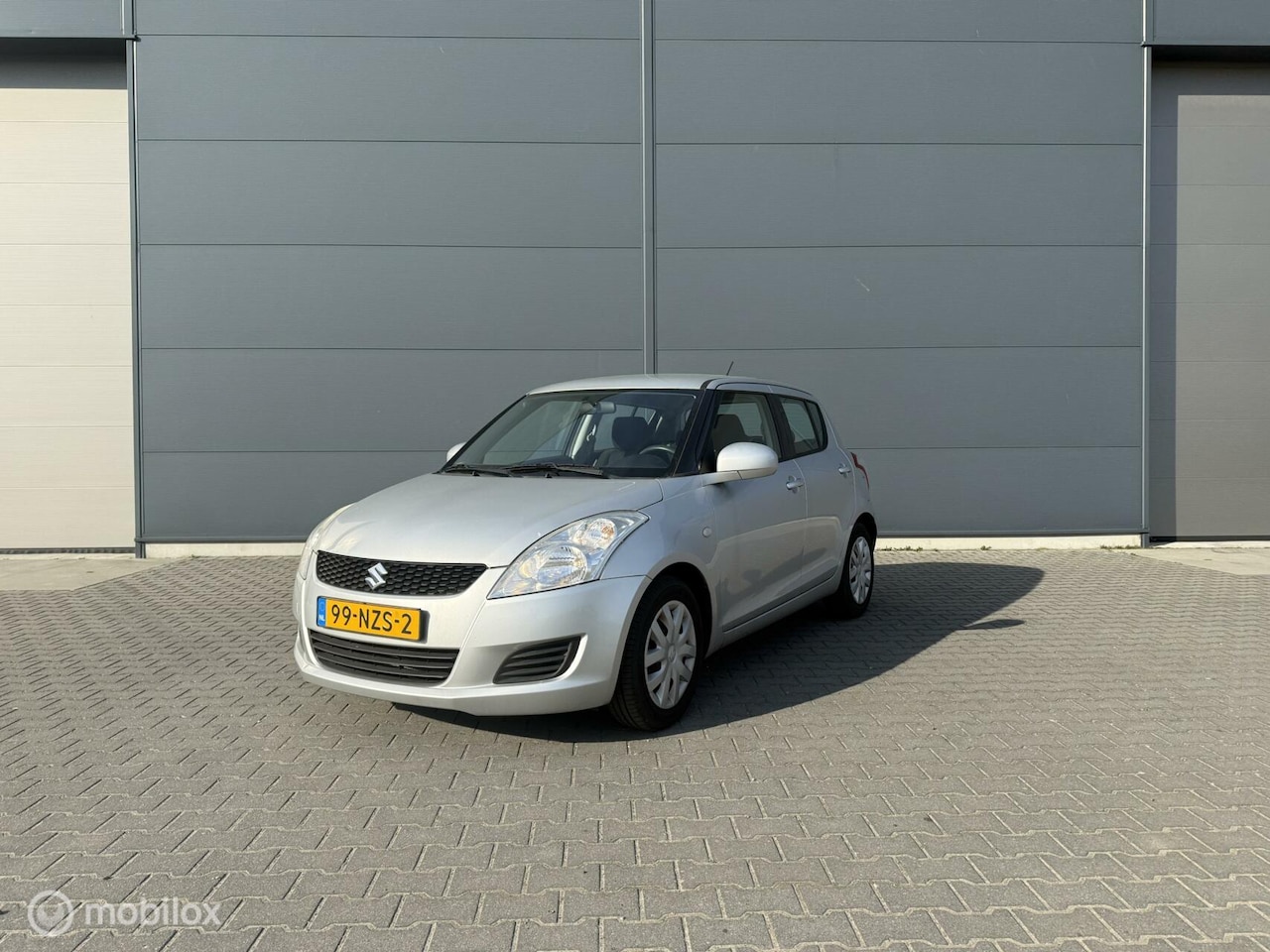 Suzuki Swift - 1.2 Comfort Airco 5-deurs Zilver 2011 - AutoWereld.nl