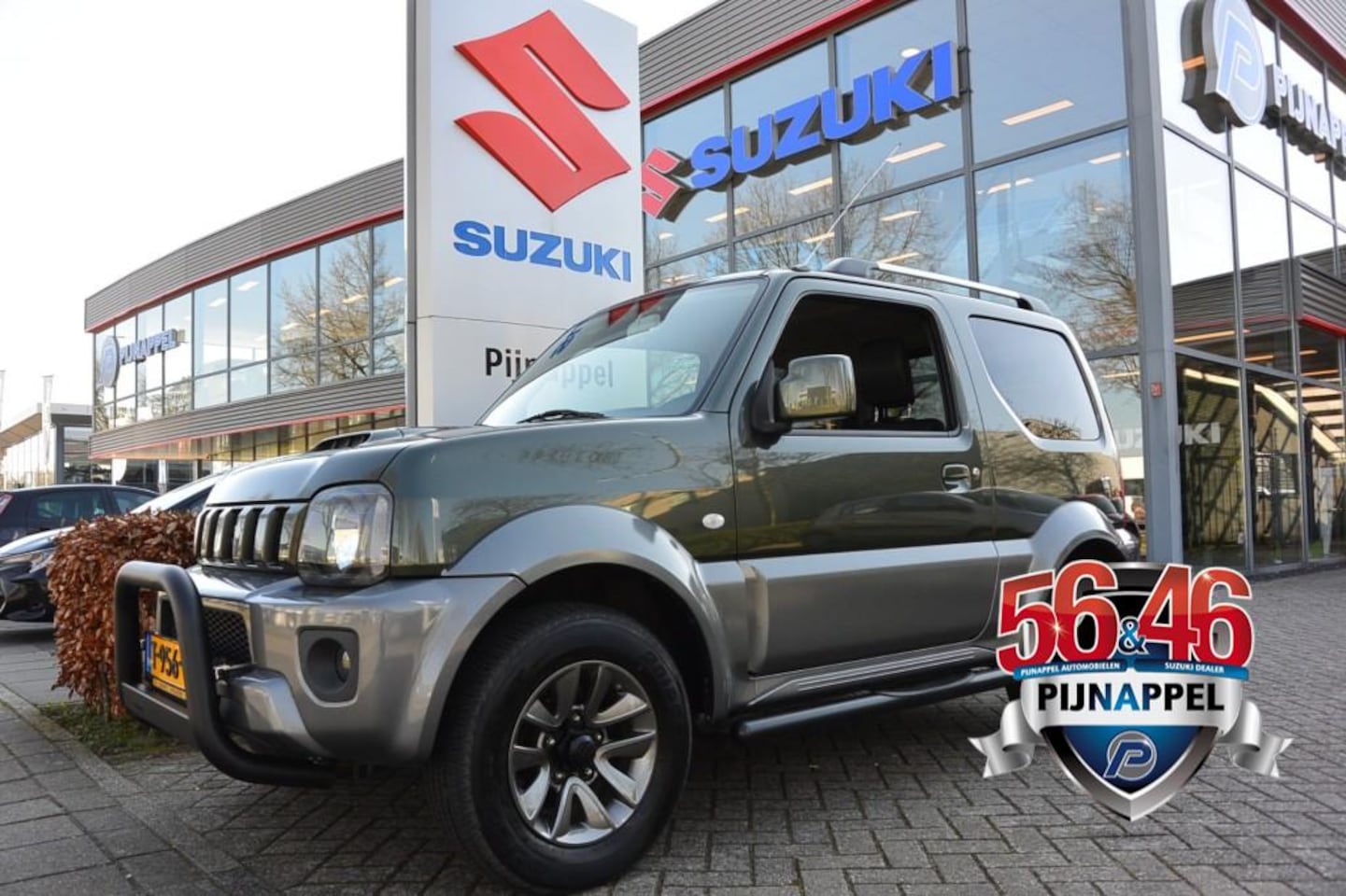 Suzuki Jimny - 1.3 Exclusive 4x4 Leder/Airco/Sidebars/Pushbar/Trekhaak - AutoWereld.nl