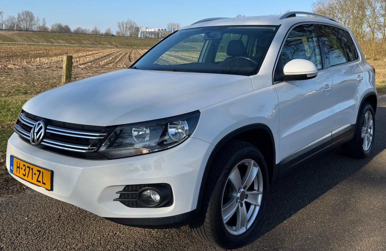 Volkswagen Tiguan - 2.0 TSI 2013 Sport&Style AUTOMAAT CLIMA CRUISE - AutoWereld.nl