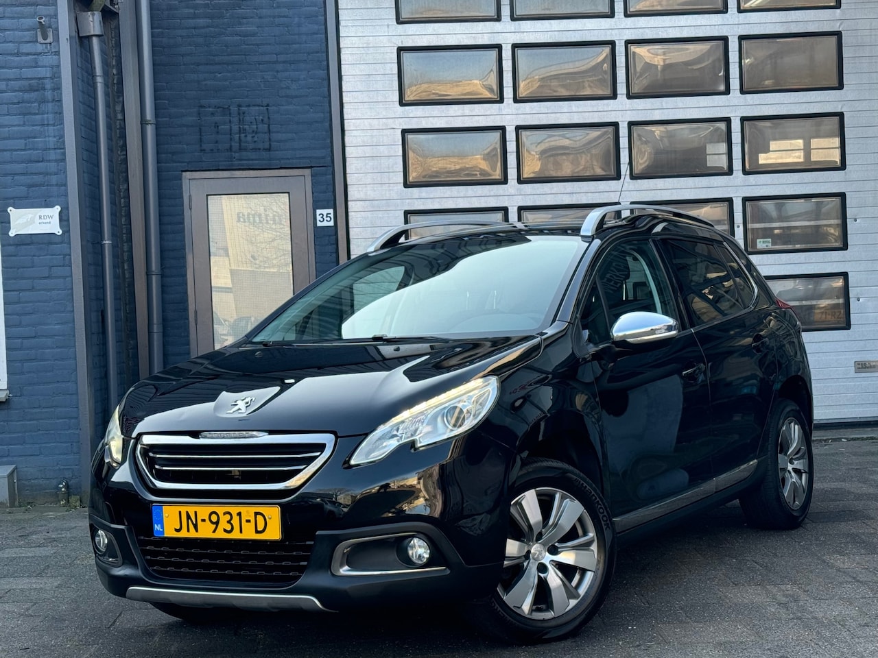 Peugeot 2008 - 1.2 PureTech Allure | Clima | Navi | Pano | Cruise | N.A.P - AutoWereld.nl