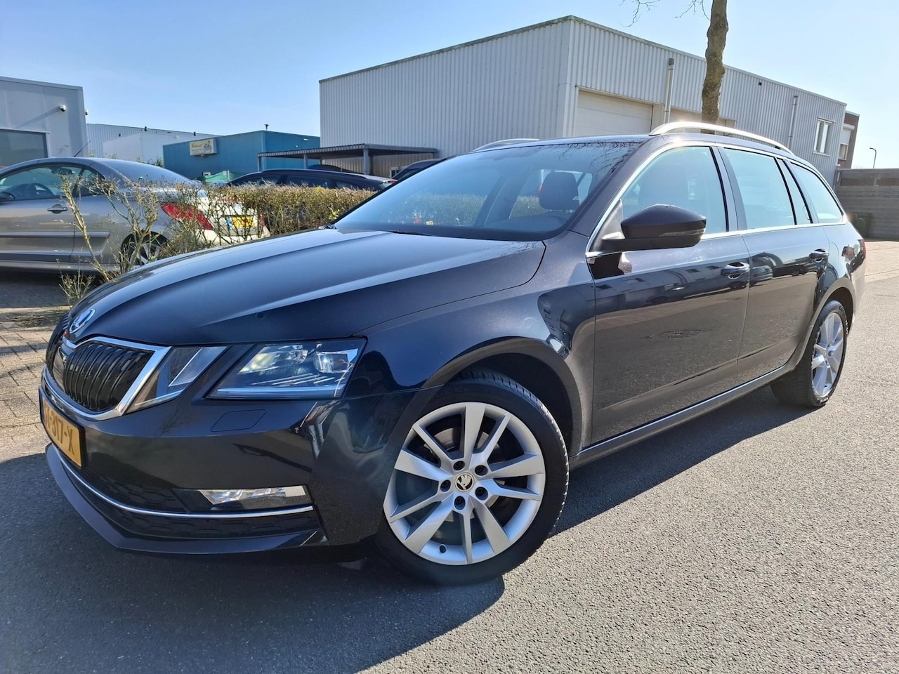 Skoda Octavia Combi - 1.0 TSI CLIMA/CRUISE/NAVI/XENON/KEYLESS - AutoWereld.nl